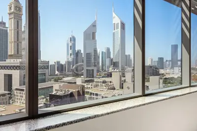 a view of a city skyline from a window at Silkhaus Exclusive 1BDR Stay at Sky Gardens in DIFC in Dubai