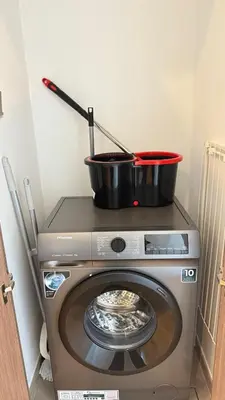 a pot on top of a washing machine at Luxury 2BR Downtown ,5 min walk to Burj Khalifa and Dubai Mall in Dubai