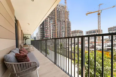 a balcony with a view of a city at 3BR Central Park, Prime Dubai Location in Dubai
