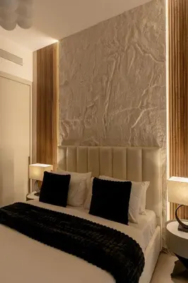 a bedroom with a large bed with black and white pillows at Nasma Luxury Stays - Chic HighRise 1 BR in the Heart of Dubai in Dubai