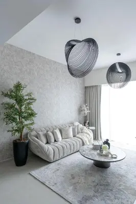 a living room with a couch and a table at Nasma Luxury Stays - Chic HighRise 1 BR in the Heart of Dubai in Dubai