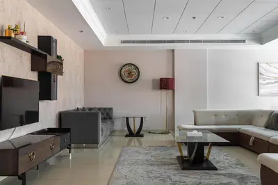 a living room with a couch and a table at Luxury Beachfront Villa with Private Pool on Palm Jumeirah near Atlantis in Dubai