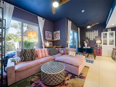 a living room with a couch and a table at Family Friendly Villa in Tilal Al Ghaf with Garden and Padel Courts Pet Friendly in Dubai