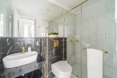 a bathroom with a sink and a toilet and a shower at Frank Porter - Vincitore Benessere 2 in Dubai