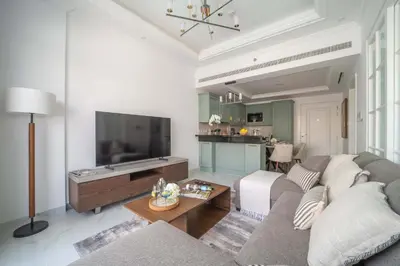 a living room with a couch and a flat screen tv at Frank Porter - Vincitore Benessere 2 in Dubai