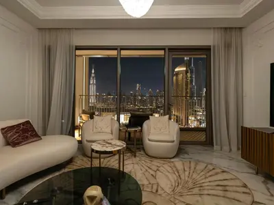 a living room with a view of a city at Elie Saab Collection by Luxe Manor - Dubai Mall Residences in Dubai