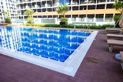 a swimming pool in the middle of a building at Stylish 1-Bedroom Apartment with Modern Interior in Dubai