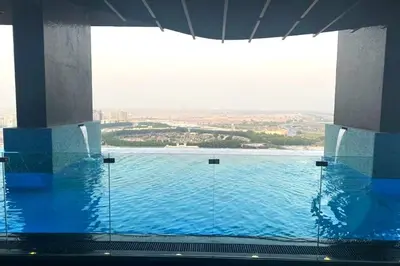 a view of a large pool of water in a building at Studio Near Dubai Butterfly Garden, 18 Mins Drive From Mall of Emirates, Miraclz Tower, Arjan By Deluxe Holiday Homes in Dubai