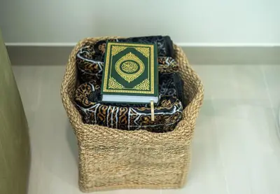 a basket with a book on top of it at New 2BR with Jacuzzi and Big Balcony In City Center in Dubai