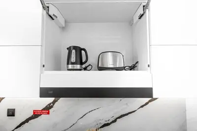 a kitchen with two appliances on a shelf at New 2BR with Jacuzzi and Big Balcony In City Center in Dubai