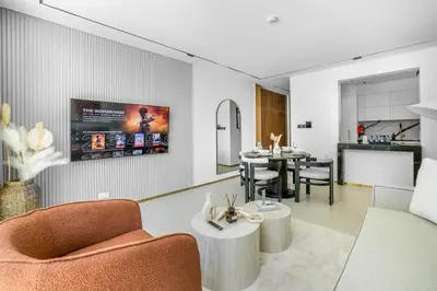 a living room with a couch and a table at New 2BR with Private Jacuzzi in City Centre in Dubai
