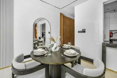 a dining room with a table and two chairs at New 2BR with Private Jacuzzi in City Centre in Dubai