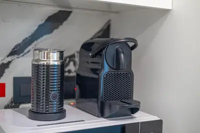 a black appliance sitting on top of a shelf at New 2BR with Private Jacuzzi in City Centre in Dubai