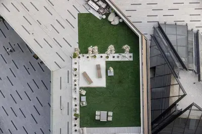an overhead view of a building with a garden at Elegant Cozy Studio Canal View in Dubai