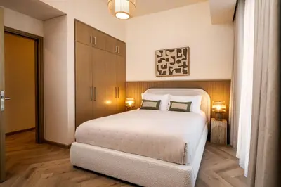 a bedroom with a large white bed with two pillows at Seraya Residences at 52-42 EMAAR in Dubai