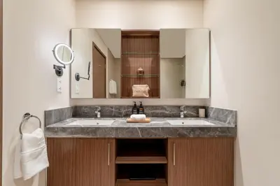 a bathroom with a sink and a mirror at Seraya Residences at 52-42 EMAAR in Dubai