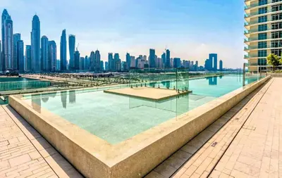 a view of a city skyline with buildings at Peerless 3BR Beachfront Living in Sunrise Bay in Dubai