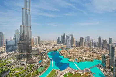 a view of a city with a river and skyscrapers at The Skyline Burj Retreat in Dubai