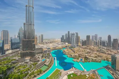 a view of a city with a river and skyscrapers at The Skyline Burj Retreat in Dubai