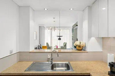 a kitchen with a sink and a counter top at Burj Vista - Prime Downtown Dubai in Dubai