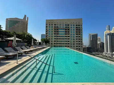 a large swimming pool on the roof of a building at Panoramic Marina 1BR City Skyline Views with Balcony, Pool & Gym Access in Dubai