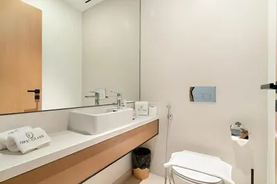 a bathroom with a sink and a mirror at Panoramic Marina 1BR City Skyline Views with Balcony, Pool & Gym Access in Dubai