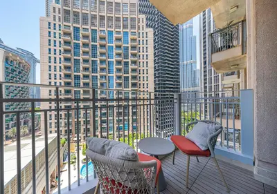 a balcony with a view of a city skyline at Stunning 1 BR Apartment Walk to Burj Khalifa & Dubai mall in Dubai