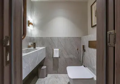 a bathroom with a toilet and a sink at Stunning 1 BR Apartment Walk to Burj Khalifa & Dubai mall in Dubai