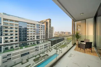 a balcony with a view of a building at Stylish 1BR in Dubai Hills - Pool, Gym & Near Dubai Hills Mall in Dubai