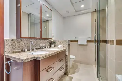 a bathroom with a sink and a shower at GuestReady - Delightful haven near Burj Khalifa in Dubai
