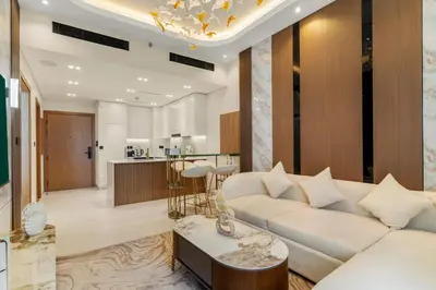 a living room with a couch and a table at Bright 1BR Retreat with Pool Access Near The Palm & Dubai Marina Hotspots in Dubai