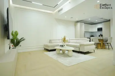 a living room with a couch and a table at Stylish 1B in Heart of Marina Near Attractions in Dubai