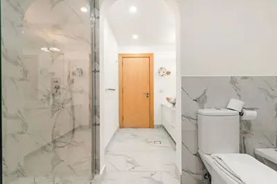 a bathroom with a toilet and a shower at VayK - Stunning 2BR with Sea View & Beach Access in Dubai