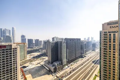 an aerial view of a city with a highway at Burj Nujoom I Studio I Downtown in Dubai