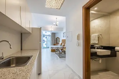 a kitchen with a sink and a counter at Millennium Binghatti Studio I Business bay I Studio in Dubai