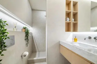 a bathroom with a sink and a shower at VayK - Great Escape at Anantara The Palm Residences in Dubai