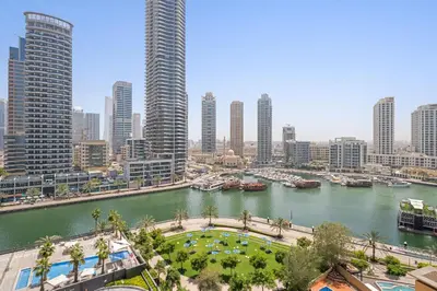 a view of a river in a city with tall buildings at VayK - Premium 2BR Stay in Dubai Marina in Dubai