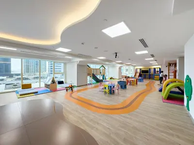 an office lobby with colorful chairs and tables at VayK - Comfortable Studio in JLT with Amazing Amenities in Dubai