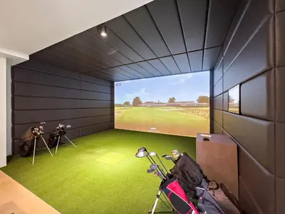 a room with a view of a golf course on the screen at VayK - Comfortable Studio in JLT with Amazing Amenities in Dubai