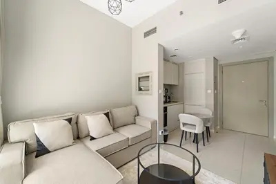 a living room with a couch and a table at VayK - Stylish 1BR in Business Bay in Dubai