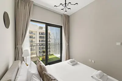 a bedroom with a bed and a large window at VayK - Stylish 1BR in Business Bay in Dubai