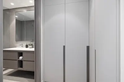 a bathroom with a sink and a mirror at SkyHigh Luxury 2BR Burj View Private Hot Tub Walk to DubaiMall in Dubai