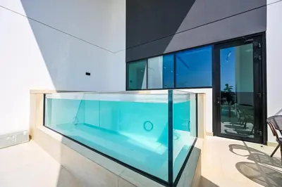 a large aquarium in front of a house at Stunning 2BDR Luxury Private Pool and Terrace in Dubai