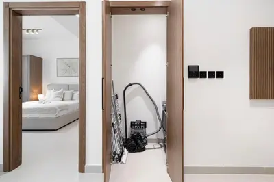 a bedroom with a bed and a mirror in a room at Cozy Apartment Gym Pool High 17th Floor JVC Gateway to Dubai in Dubai