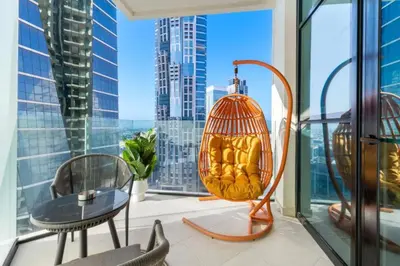 a balcony with a view of a city at Loft-Style Studio - Canal View - Fully Furnished - Near Dubai Mall - Burj Khalifa in Dubai