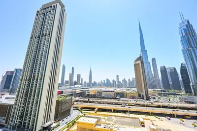 a view of a city skyline with tall buildings at DTV 2BR Burj View, Pool in Dubai