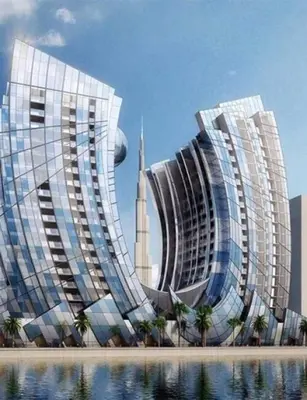 two tall buildings next to a body of water at Tranquil Haven Near Burj Khalifa in Dubai