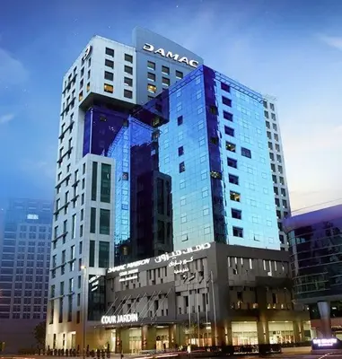 a santara building with a sign on it at DAMAC 1BHK Apt Business Bay Dubai with Pool & Canal Walk in Dubai