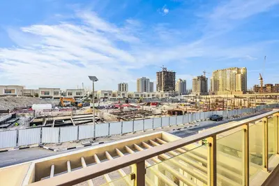 a view of a city from a balcony at Stylish 4BR Family Villa Easy Access to Dubai Marina & Expo City in Dubai