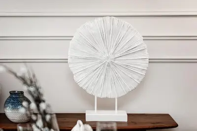 a white paper fan on a stand on a table at Luxury living , Triple pool access at Marina views in Dubai